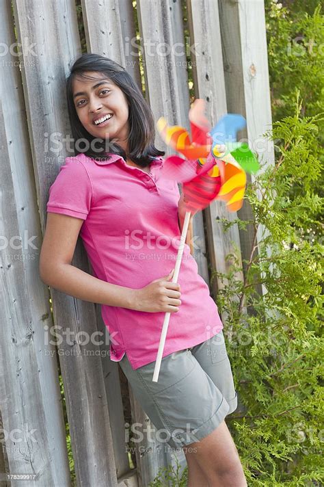 Girl With Pinwheel In Outdoors Stock Photo Download Image Now Asian