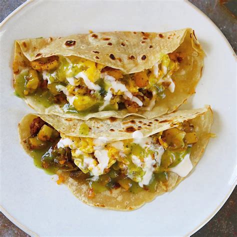 quick breakfast tacos with potato eggs chorizo cheese and hatch green chile the 2 spoons