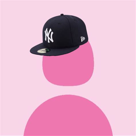 A New York Yankees Cap On A Pink Background