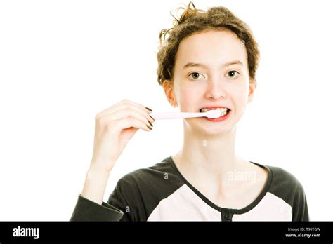 teen brushing teeth telegraph