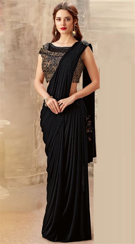 Ariani will improve their tag name to increase satisfaction of their customer by putting their tag name at outside the scarf. Lycra Sequins work Black Ready to wear designer saree MS501755
