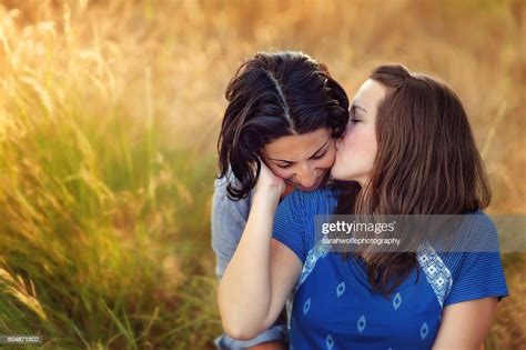 Lesbian Woman Kissing Her Partners Cheek While Outside Photo Getty Images