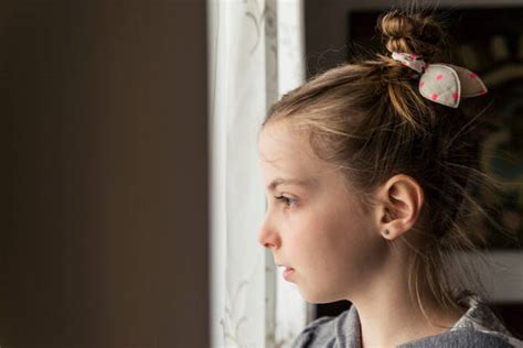 Sad Beautiful Girl At Home Looking Out Of Window Stock Photos Pictures