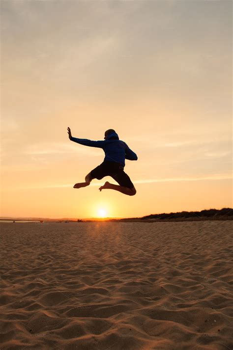 Man Silhouette Jumping At Sunset ~ People Photos On Creative Market