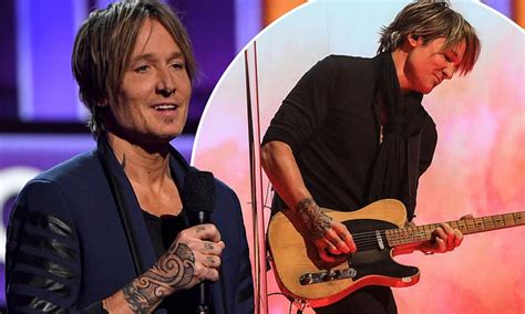 Keith Urban Shows Off New Tribal Ink Design On His Hand At The 56th