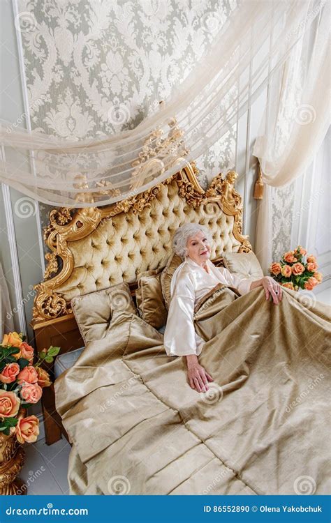 Elegant Mature Lady Resting In Bedroom Stock Photo Image Of Design