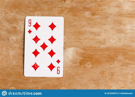 Nine Of Diamonds Playing Card On Wooden Background Top View Stock