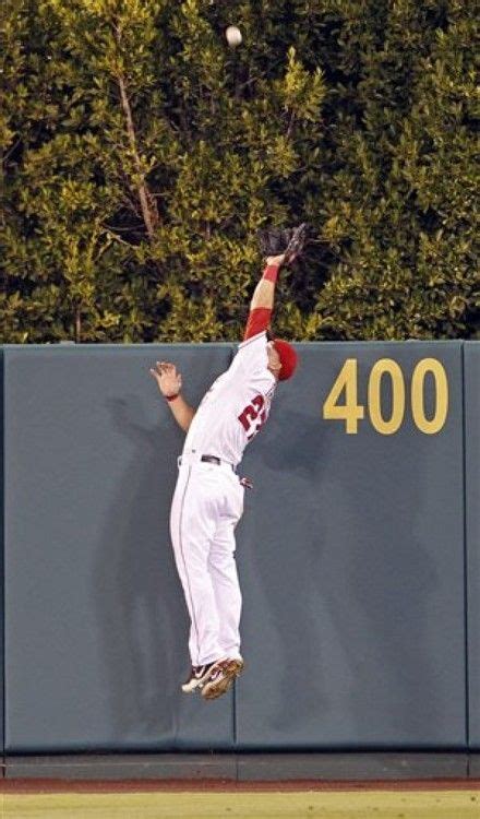 Trout Brings One Back Mike Trout Leaps High Over The Outfield Wall For An Amazing Catch