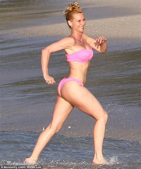 Pretty And Incredibly Pert In Pink Nicollette Sheridan Splashes About In A Bright Bikini In St