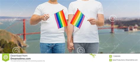 male couple with gay pride rainbow flags stock image image of male husband 115885069