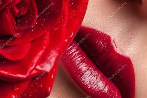 Red Lips On A Background Of Lush Roses Lips And Flower Close Up Stock