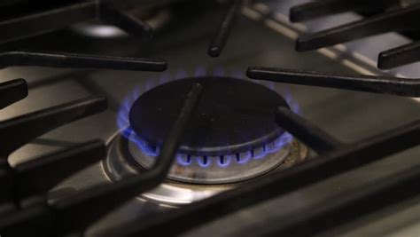Medium low heat on stove. Stock video of a close up shot of a | 15414112 | Shutterstock