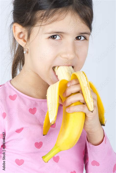 Girl Eating Banana Stock Photo Adobe Stock