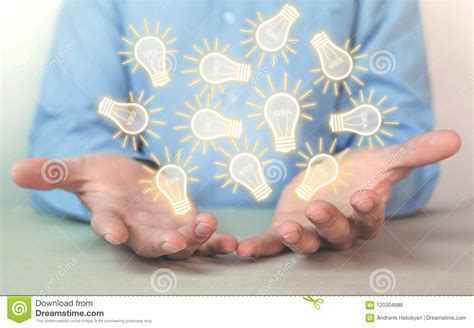 Businessman Holding Light Bulbs Concept Of New Idea Stock Photo