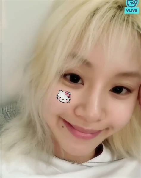 A Girl With Hello Kitty Stickers On Her Face