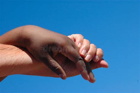 Helping Hand An Old Caucasian White Hand And A Young African American