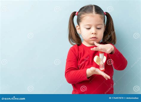 Child Holding A Sand Timer During Timeout Stock Photo Image Of Space