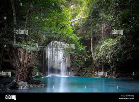 Jangle Landscape With Flowing Turquoise Water Of Erawan Cascade