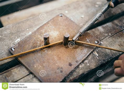 Construction Man Worker Using Industrial Tools For Bending Clamp On
