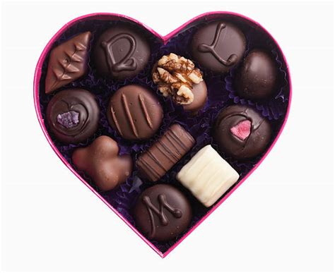 The rectangular box, decorated with a heart and geometric patterns in reds and pinks, holds three rows of chocolate hearts. Royalty Free Heart Shaped Box Pictures, Images and Stock ...