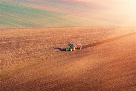 Agricultural Field With Plowing Tractor Nature Landscape Stock Image