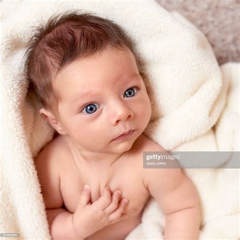Cute Baby Boy With Blue Eyes High Res Stock Photo Getty Images