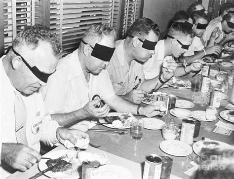 Men Eating Lunch Blindfolded By Bettmann