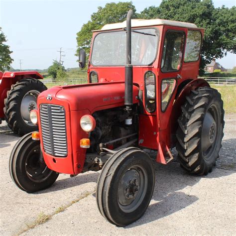 A Massey Ferguson 35x Tractor With A Duncan Cab Registration No 261