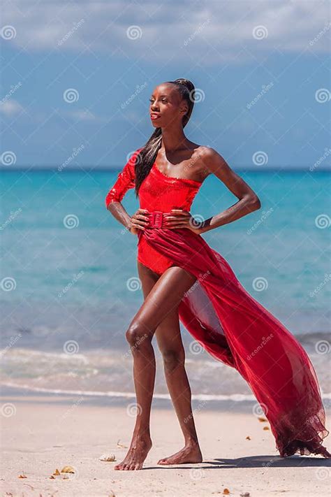 Woman Wearing Red Bikini And Dress On A Tropical Beach Remote Tropical Beach In Barbados