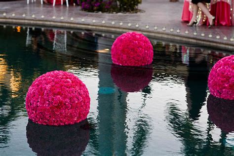 Tropical floral arrangements, heart shaped floral wreaths, and floating candles or lanterns are all popular choices that can add something. Gorgeous Pool Decorations For Weddings - Belle The Magazine