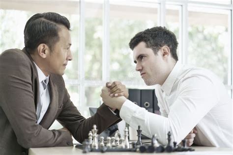 Serious Businessman Playing Board Chess Game Together Competition And