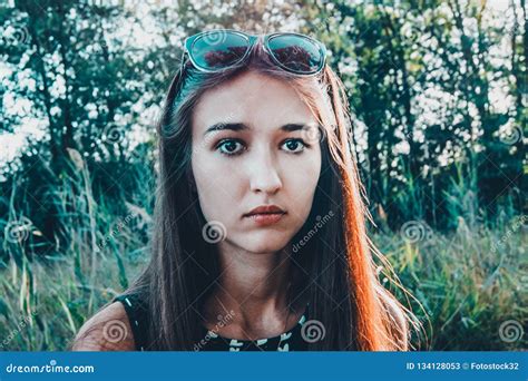A Girl With A Confused Face Looks Straight Into The Camera Stock Image Image Of Caucasian