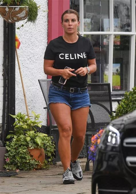 coleen rooney shows off incredibly tanned legs after arriving home from barbados holiday