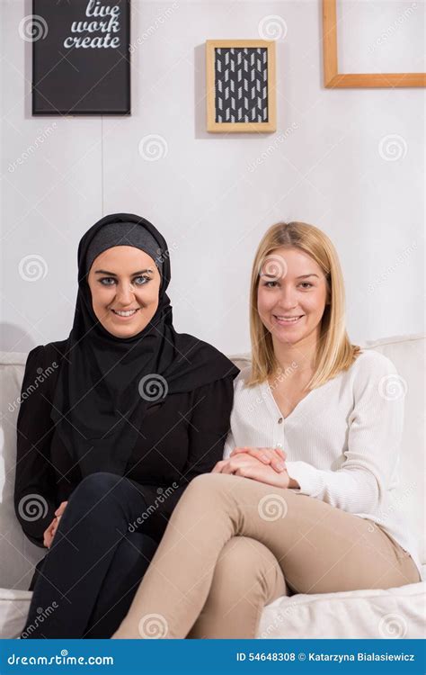 Smiling Muslim And Christian Women Stock Photo Image Of Friendship