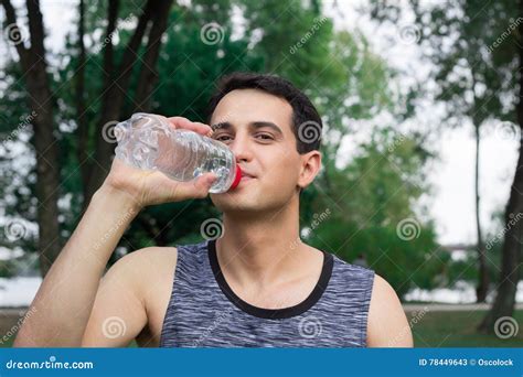 Young Fitness Man Drinks Water During Workout Outdoor Stock Image