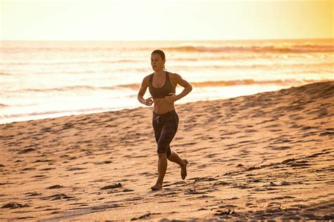 Woman Running On The Beach Photograph By Konstantin Trubavin Fine Art America