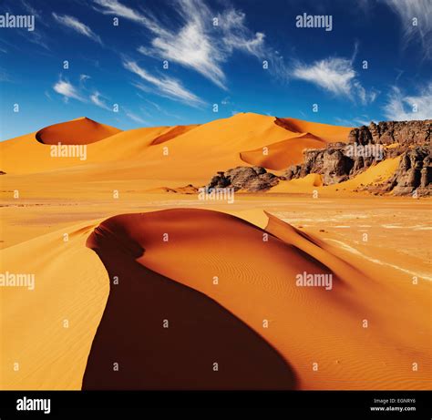 Sand Dunes And Rocks Sahara Desert Algeria Stock Photo Alamy