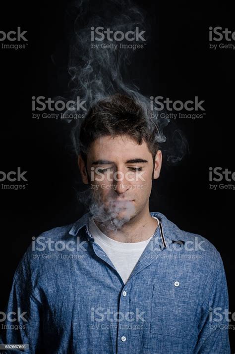Man Smoking In Dark With Visible Smoke Stock Photo Download Image Now