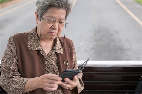 Asian Elder Woman Holding Mobile Smart Phone On Bus Elderly Sen Stock