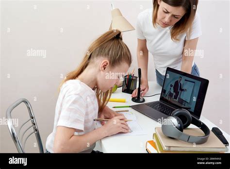 Mother And Daughter Fighting About Homework Upset Mother Is Angry To Little Bored Daughter