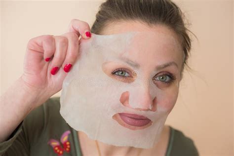 Girl In A Cosmetic Face Mask Stock Image Image Of Applying Makeup