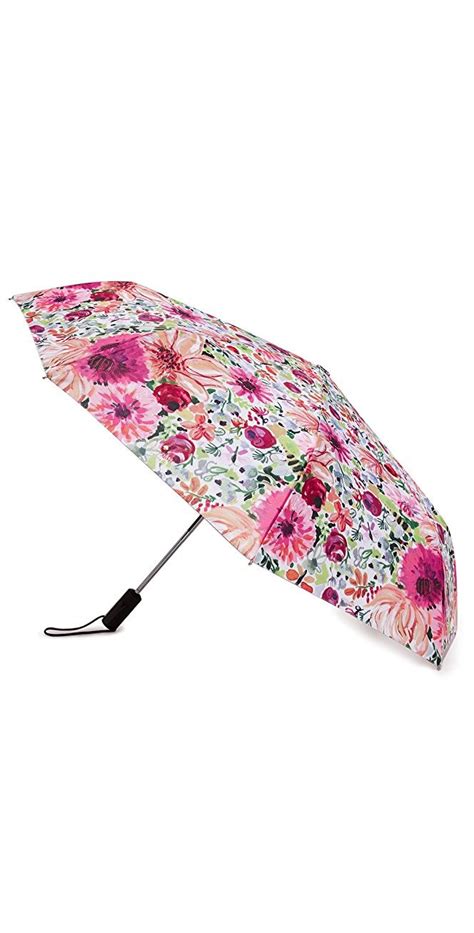 Collapsible design features a curved handle. Dahlia Travel Umbrella | Travel umbrella, Ladies umbrella ...