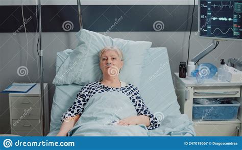Elder Patient With Iv Drip Bag And Nasal Oxygen Tube Stock Image