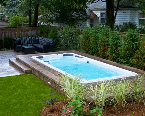 Hydropool Self Cleaning Swim Spa Installed In Ground With Stone Deck