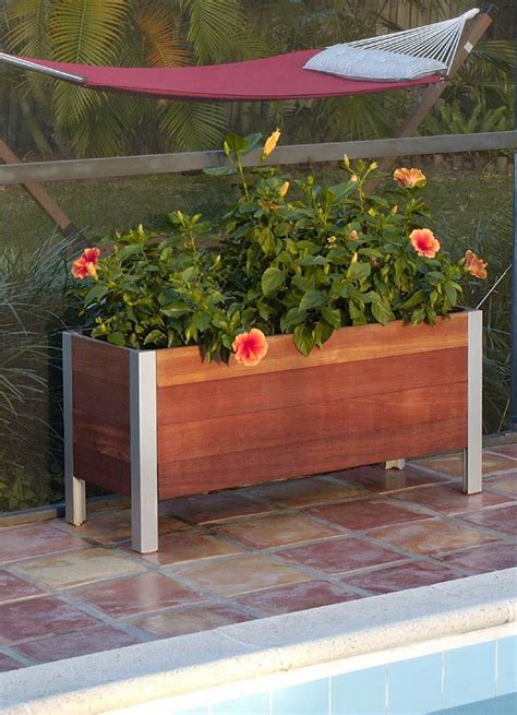 Put some petal power on your porch by hanging these rustic rectangular planter boxes above your railing. Large Wooden Rectangular Planters