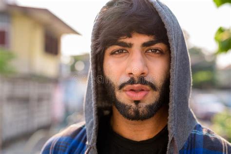 Young Handsome Bearded Indian Hipster Man In The City Streets Stock