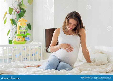 Young Beautiful Pregnant Woman In Pain With Labor Contraction Stock