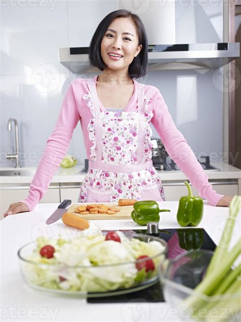 Asian Housewife In Kitchen 944232 Stock Photo At Vecteezy