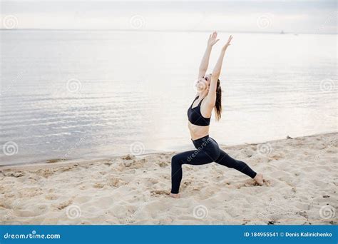 Beautiful Woman Doing Morning Exercises On The Beach Yoga Meditation
