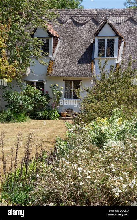 Traditional English Thatched House And Cottage Garden The Suffolk